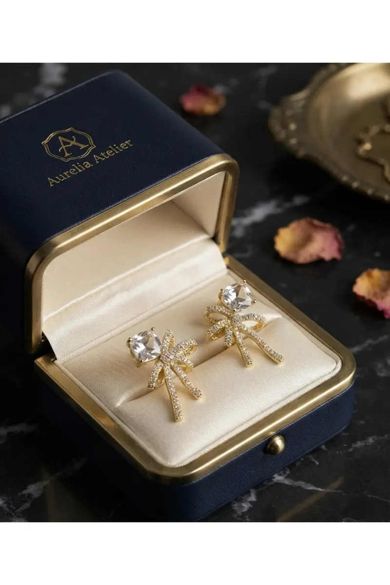 Pirinç Gold Renk Zirkon Taşlı Kurdele Model Küpe